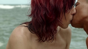Kinky Redhead Swallows Black Meat on the Beach